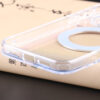Close-up of clear MagSafe stand case bottom speaker and charging port cutout