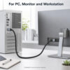 DisplayPort to DisplayPort cable connected between a desktop PC and monitor in a clean workstation setup