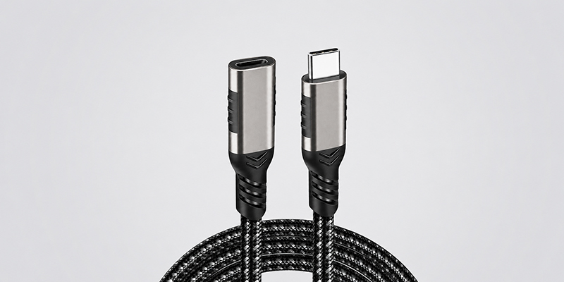 20Gbps USB-C male-to-female extension cable with braided cord and metal connector shells on a light gray background