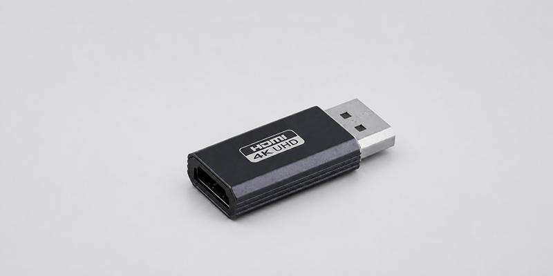 4K DisplayPort male to HDMI female adapter on a light gray background
