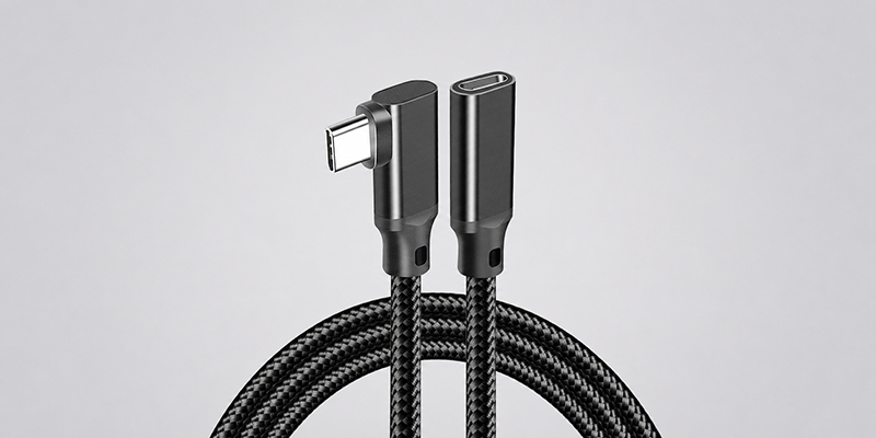 90-degree USB-C male-to-female extension cable with 20Gbps data transfer and braided cord on a light gray background