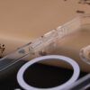 Close-up of the transparent corner and reinforced edge on the UGOjP case for iPhone 16 Series.