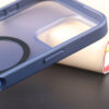 Side button detail of the dark blue UGOjP matte phone case for iPhone 16 Series.