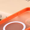 Side button detail of the orange matte phone case for iPhone 15 series.