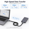 USB-C flat cable connecting a laptop and external SSD with 20Gbps, 40Gbps and 80Gbps options
